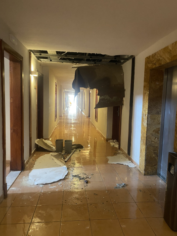 The ceiling collapses in a flooded corridor 
