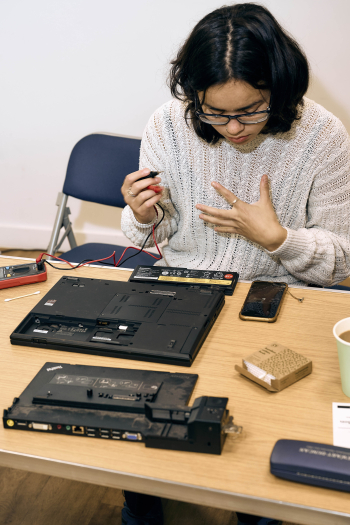 Sorcha Owens fixing a laptop