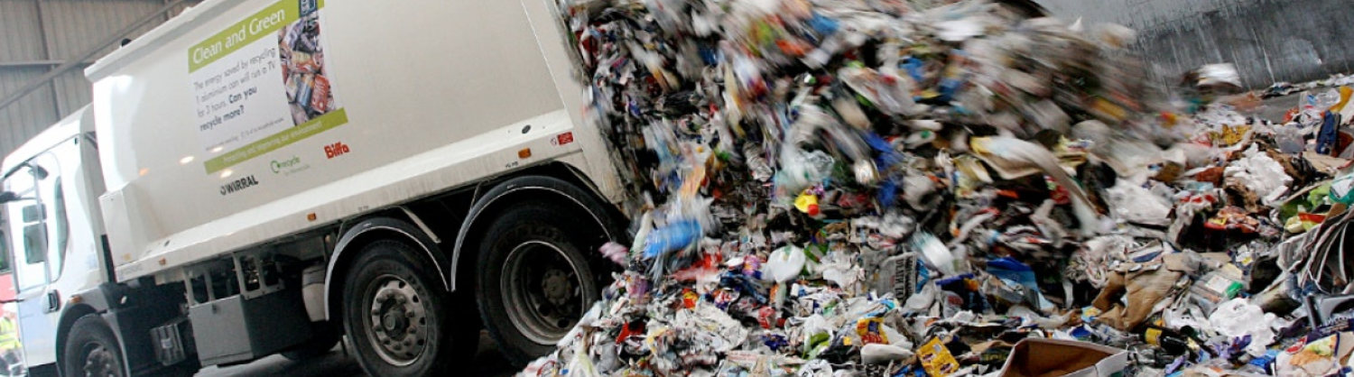Image of a recycling vehicle unloading 