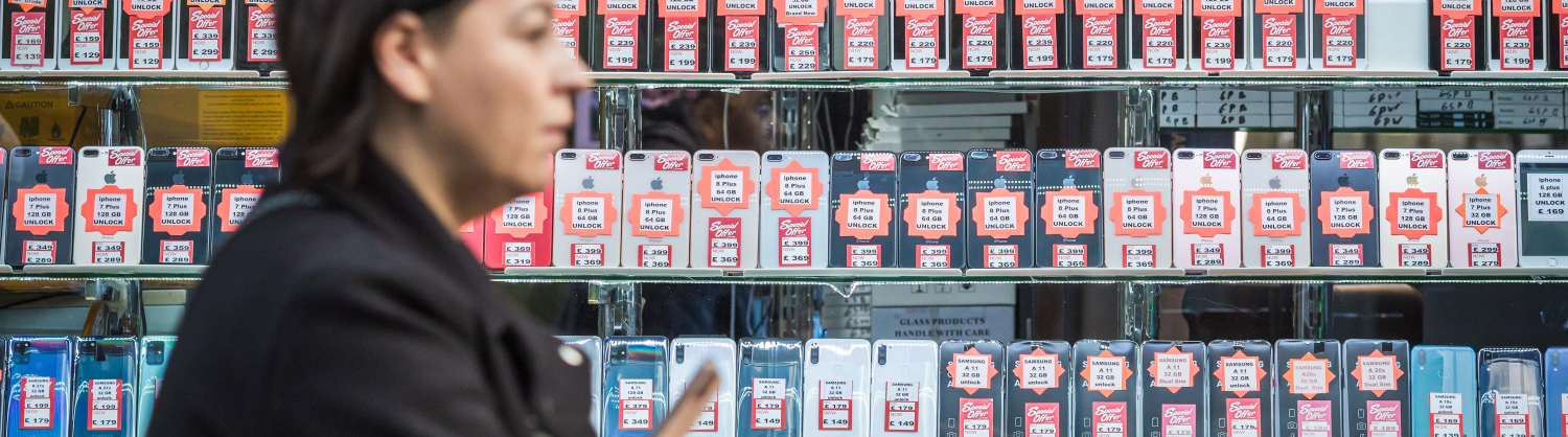 A woman in a second-hand phone shop