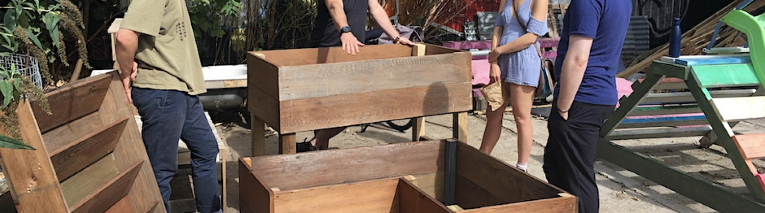 People building things out of recycled wood
