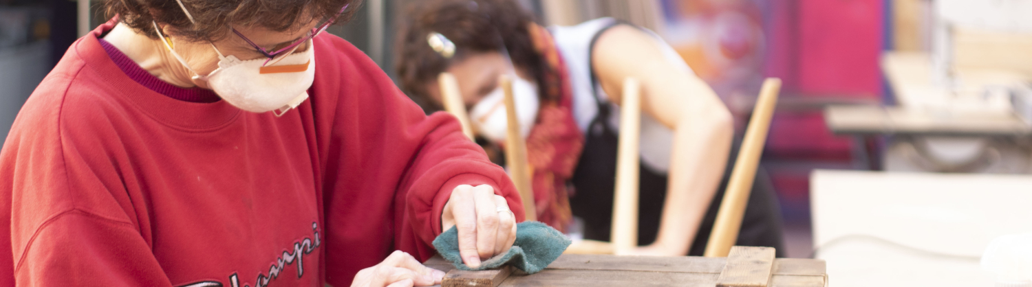 Image of woman sanding a wooden box