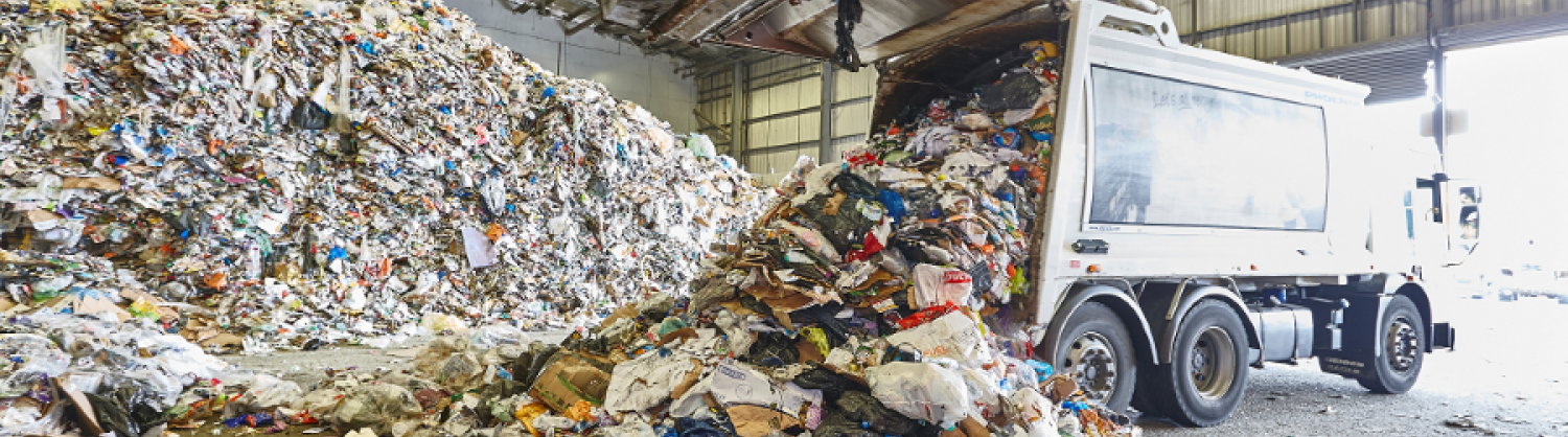 Recycling truck tipping out recyclable material