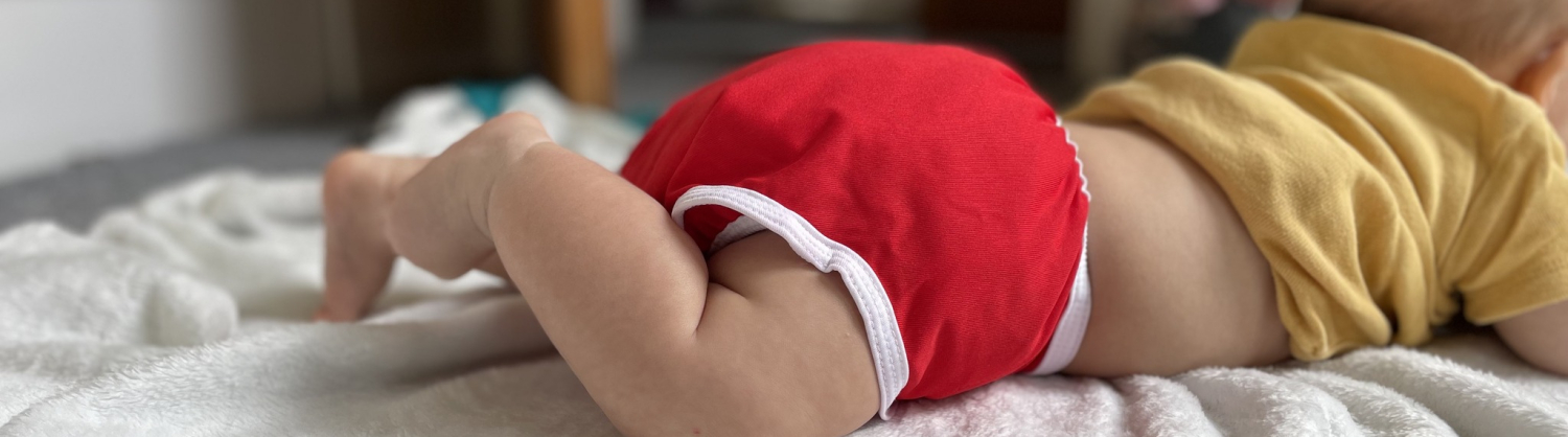 Baby in reusable nappy