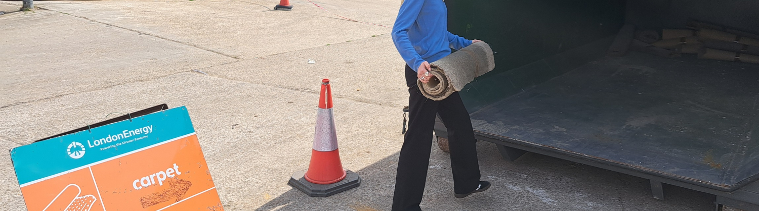 Resident recycling carpet in the dedicated container at South Access Road Reuse and Recycling Centre