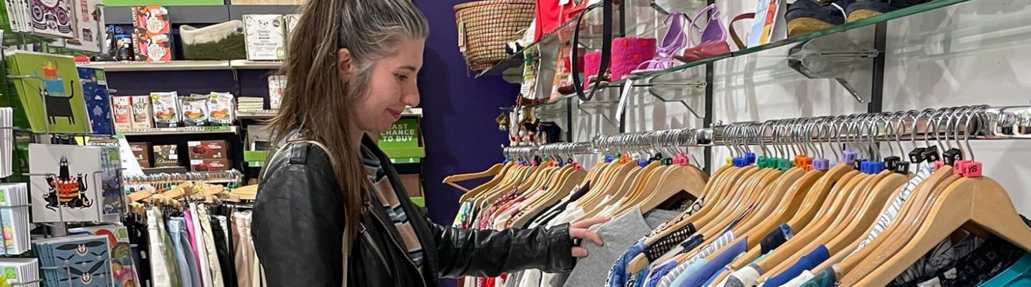 Woman shopping in charity shop