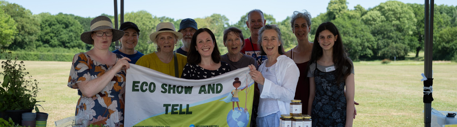 People standing at a stall at a sustainability event