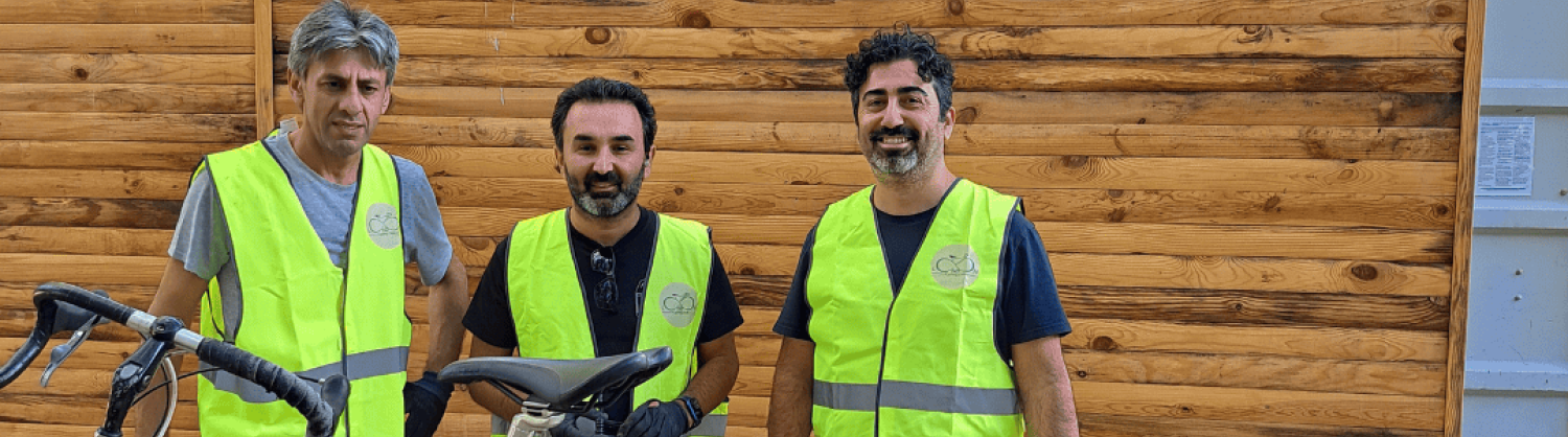 3 volunteers at a bike repair day in Pymmes Park
