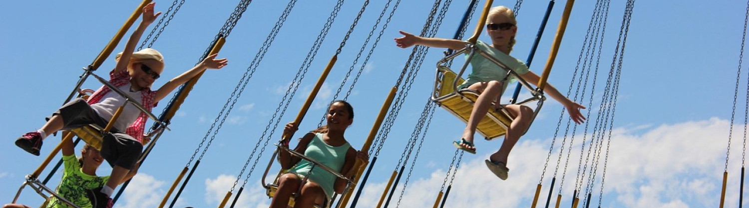 Children riding on a fairground ride