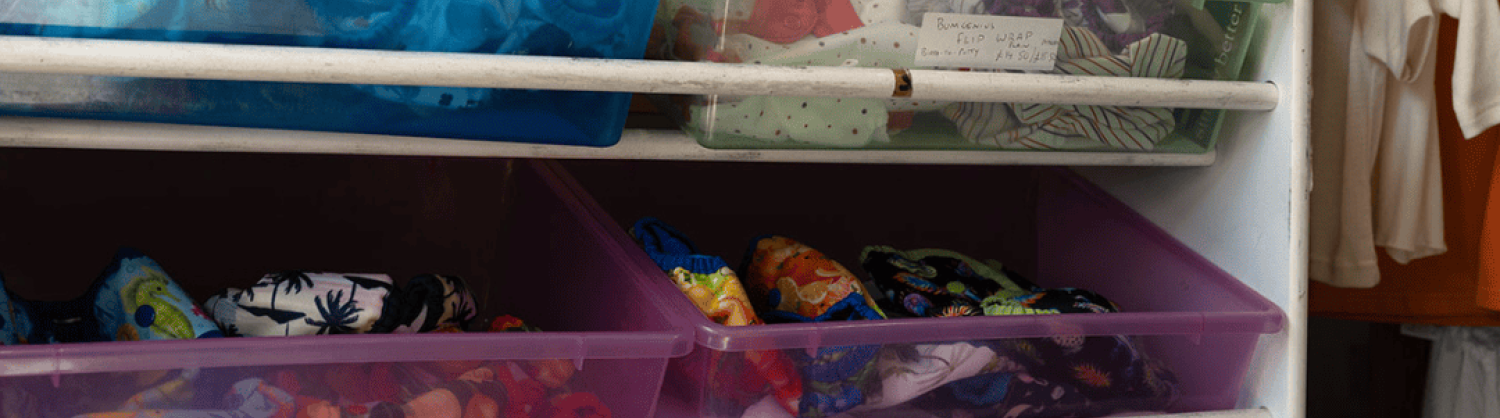 A picture of baby clothes and items