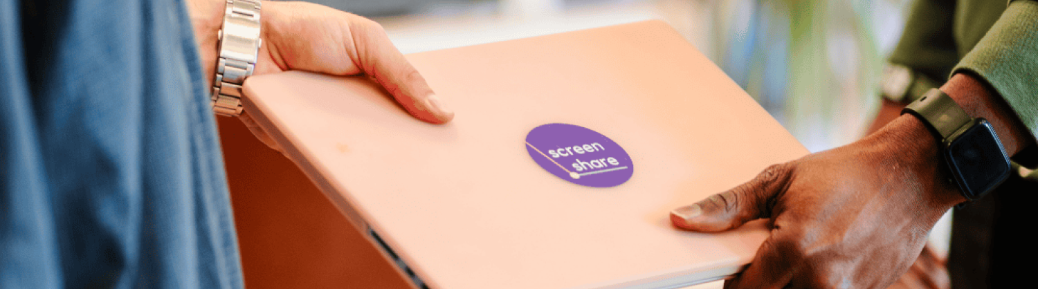 Laptop passing between hands with Screen Share logo