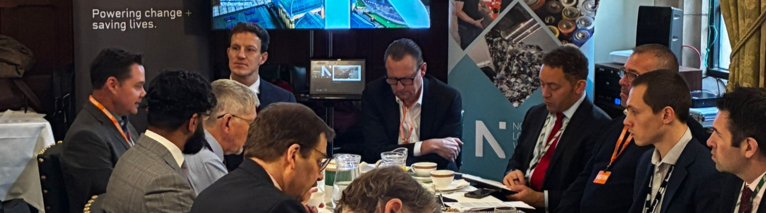 A group of people sit around a table 