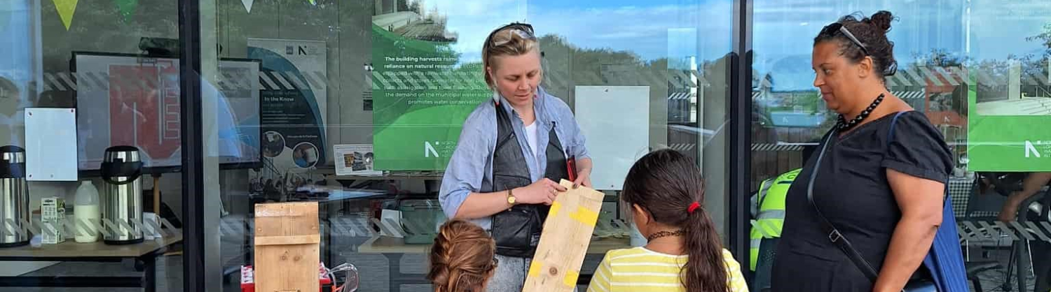 Children taking part in woodworking session outside EcoPark House