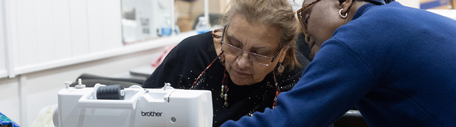 Participants of a previous Arachne session, repairing a clothing item