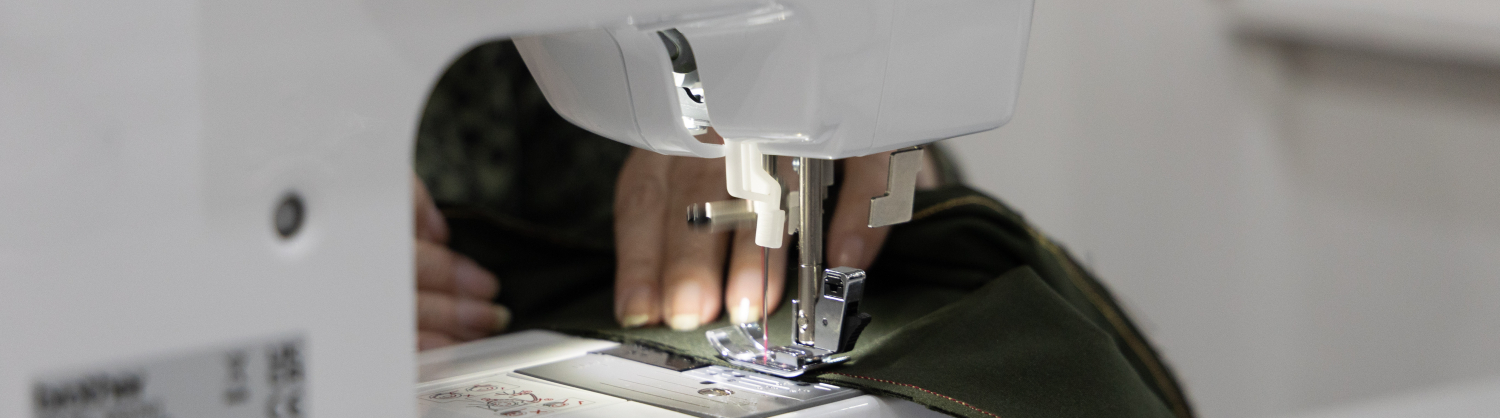 Textile being repaired with a sewing machine 