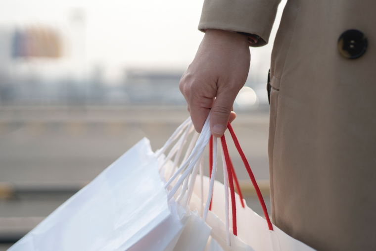 Person holding shopping bags