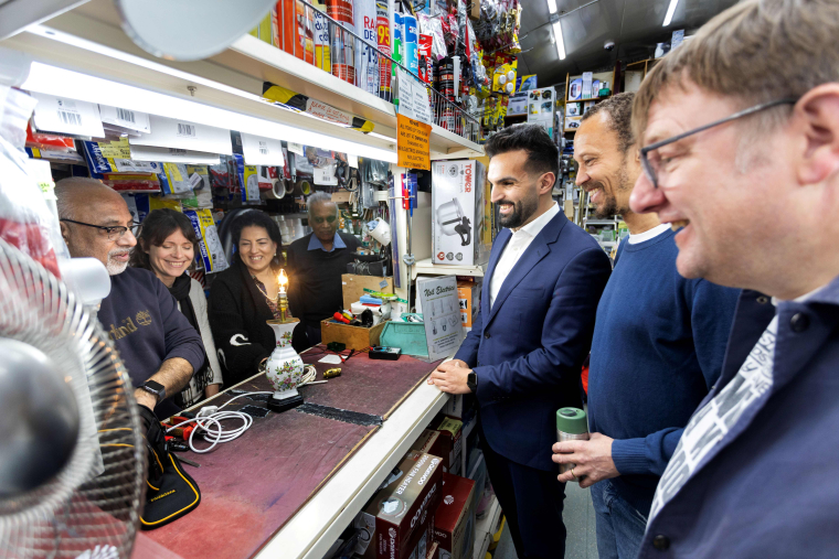 Councillors talking to repair business owners