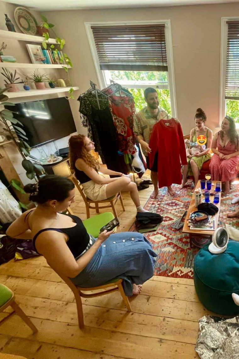 A group of friends at a clothes swap (with one friend recommending items)