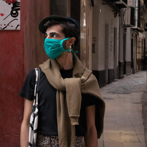 man wearing green face mask