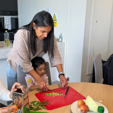 Parent and child participating in a cooking workshop