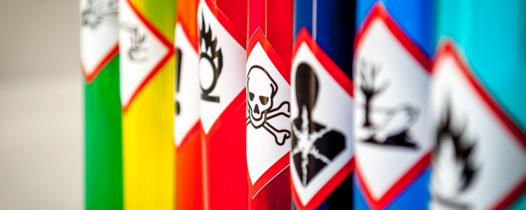 Chemical aerosol bottles with warning sign 