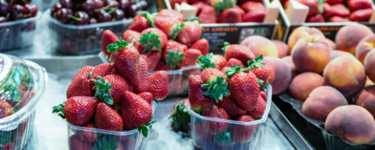 strawberries, cherries and peaches in punnets,