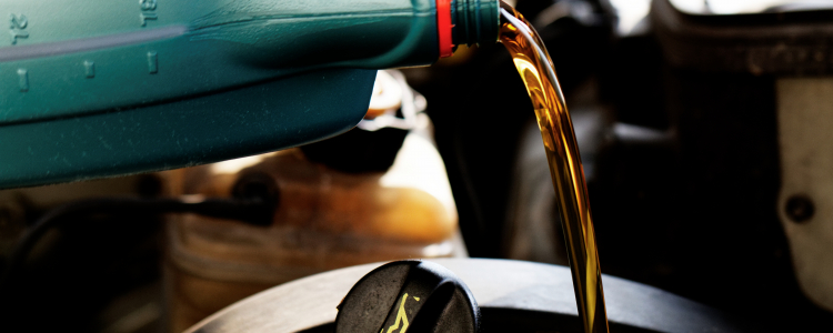 Engine oil pouring into a car