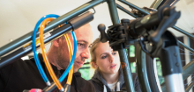 Repair specialist helps to fix bicycle