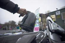 A kettle being placed in an electrical waste container.