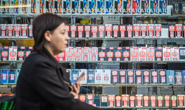 A woman in a second-hand phone shop